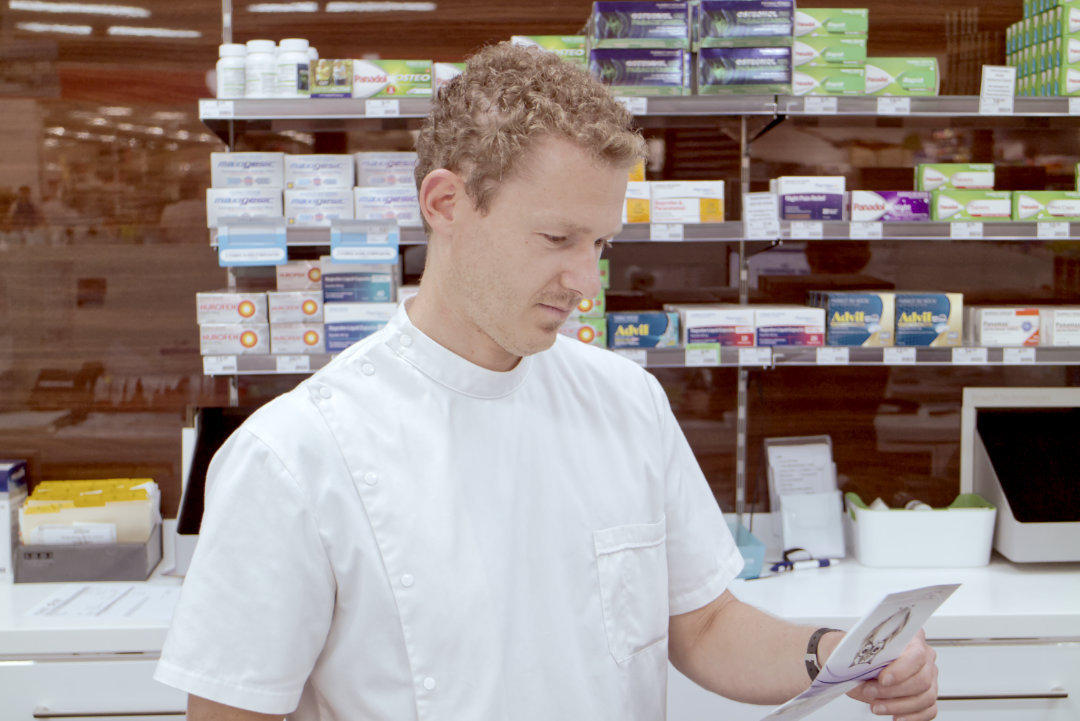 Pharmacist analysing the prescription