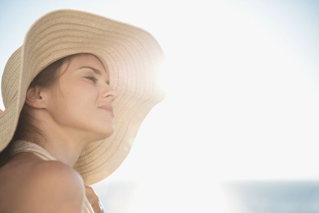 Girl at the beach exposed to sunlight