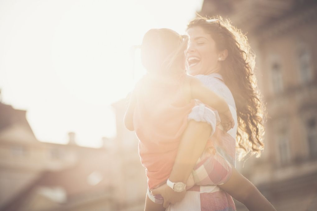 Mom and daughter enjoying sunlight